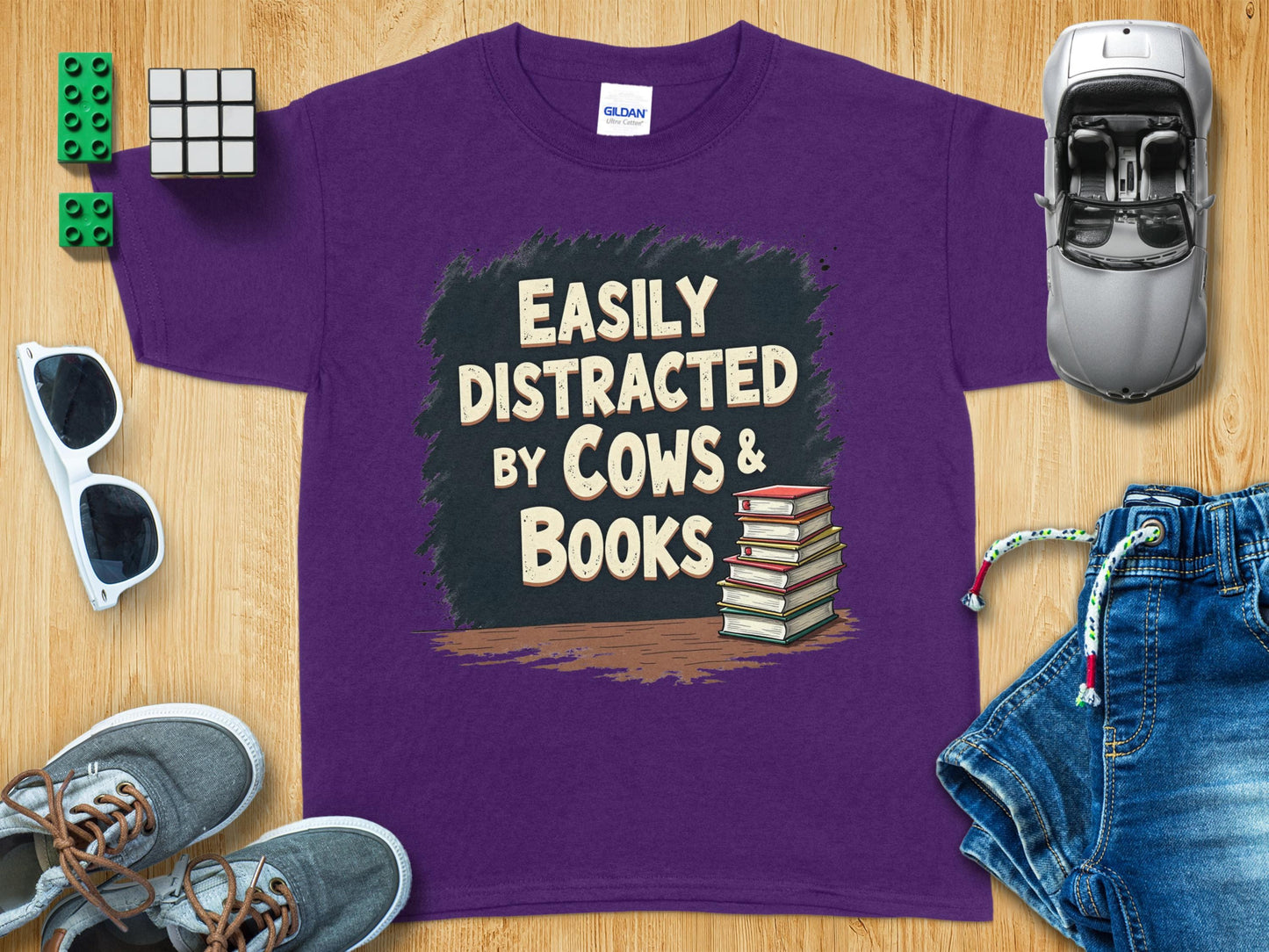 Easily Distracted by Cows and Books Graphic Tee product