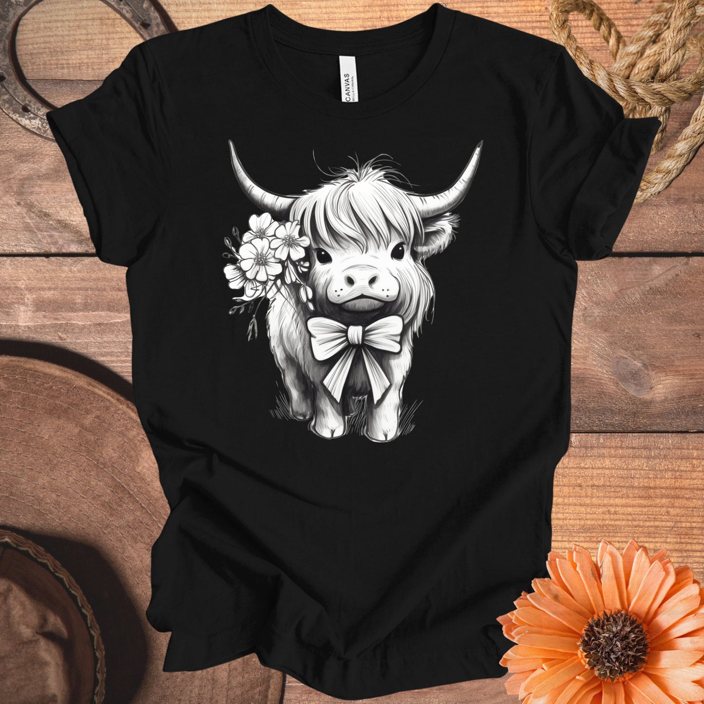 Black T-shirt with Highland Cow and Flowers graphic product type